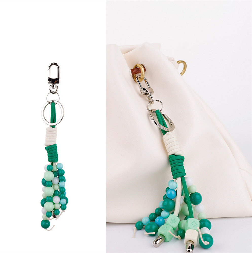 Boho-inspired stone tassel charm for a casual handbag
