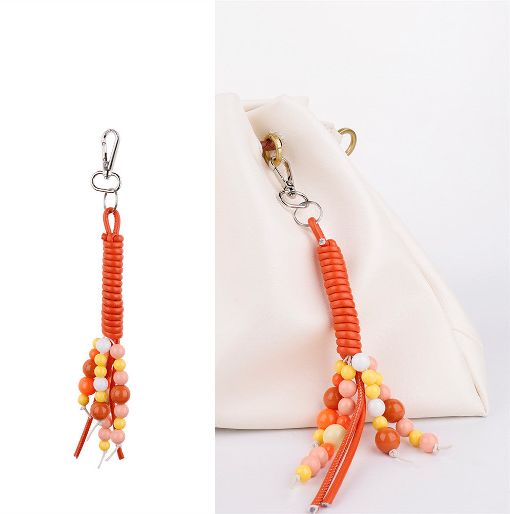 Orange bead strands beside a set of car keys
