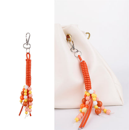 Orange bead strands beside a set of car keys