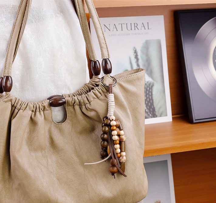 Natural stone and wooden beads paired with braided cord