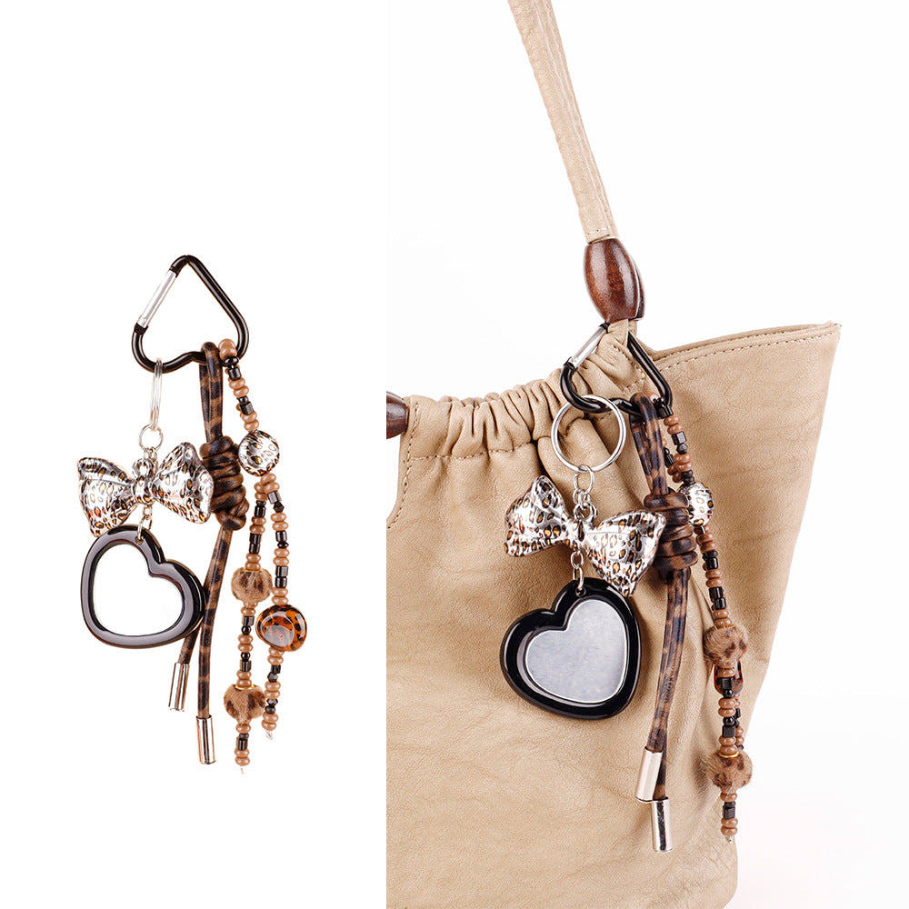 Handmade style keychain with woven cord and wood beads