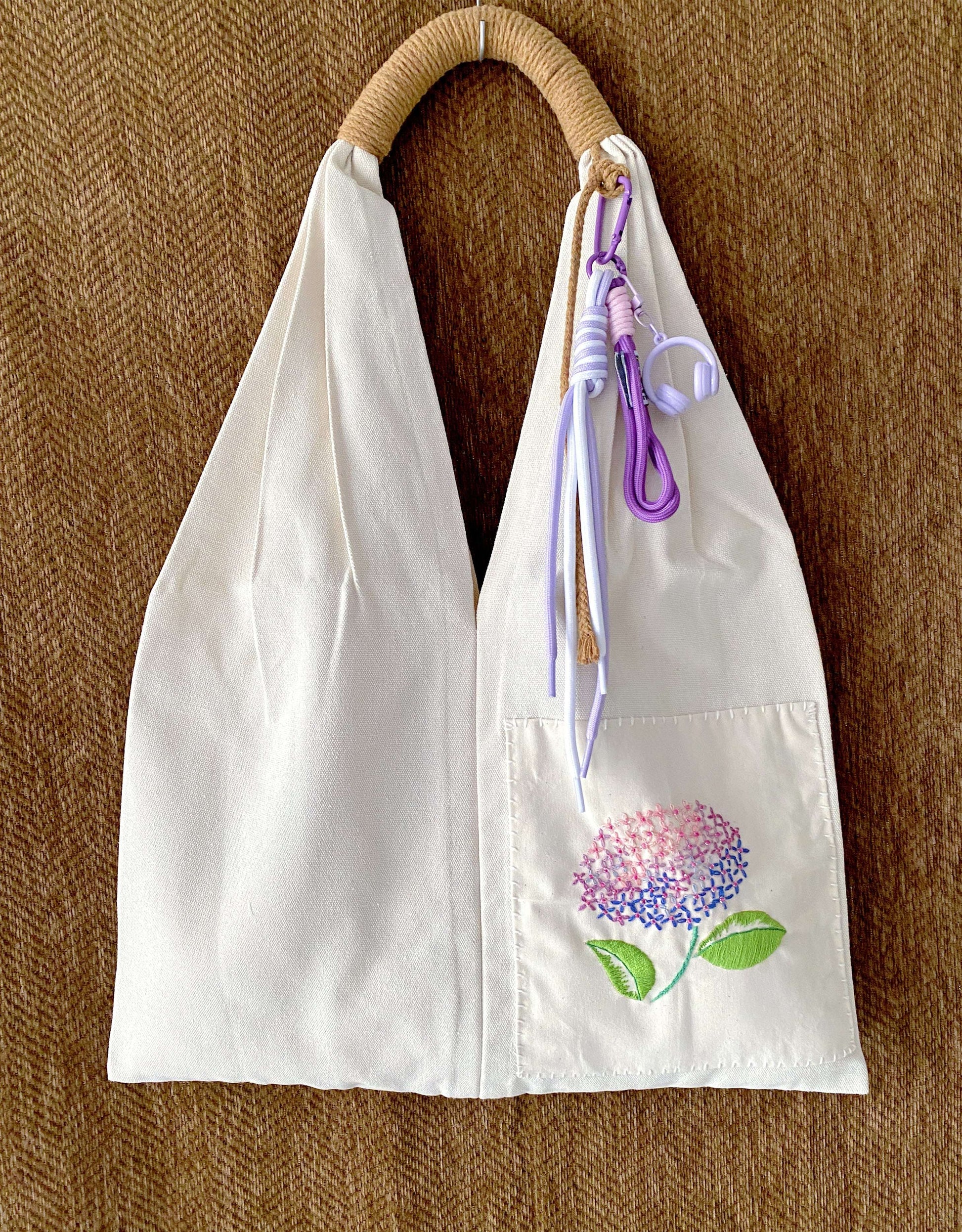Unique birthday present: a sustainable cotton tote with one-of-a-kind artisanal flower stitching.