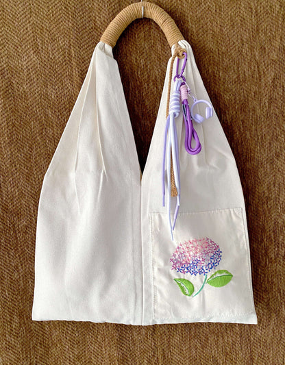 Unique birthday present: a sustainable cotton tote with one-of-a-kind artisanal flower stitching.