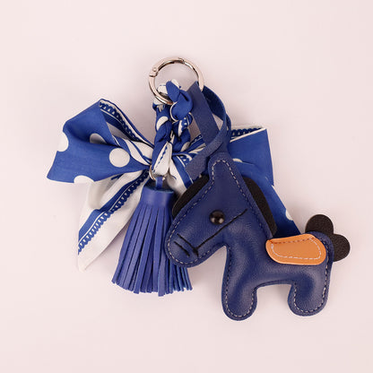 Decorative fabric charm with scarf and tassel