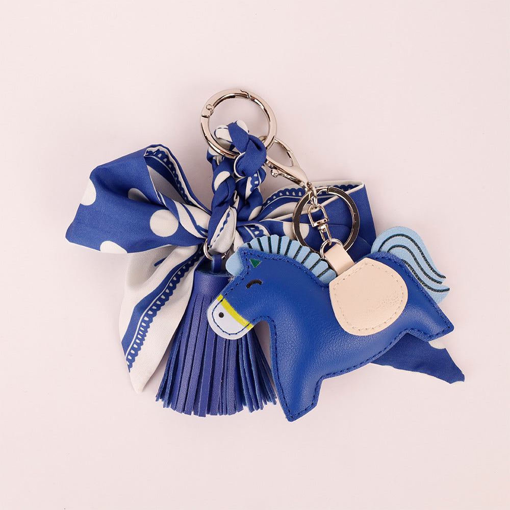 Handmade navy polka dot charm with tassel