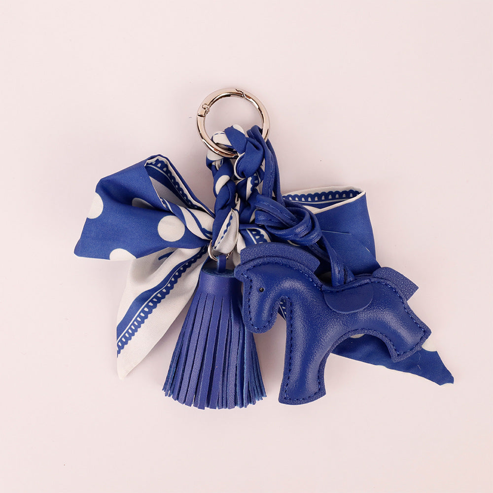 Fabric bag decoration with a navy bow design