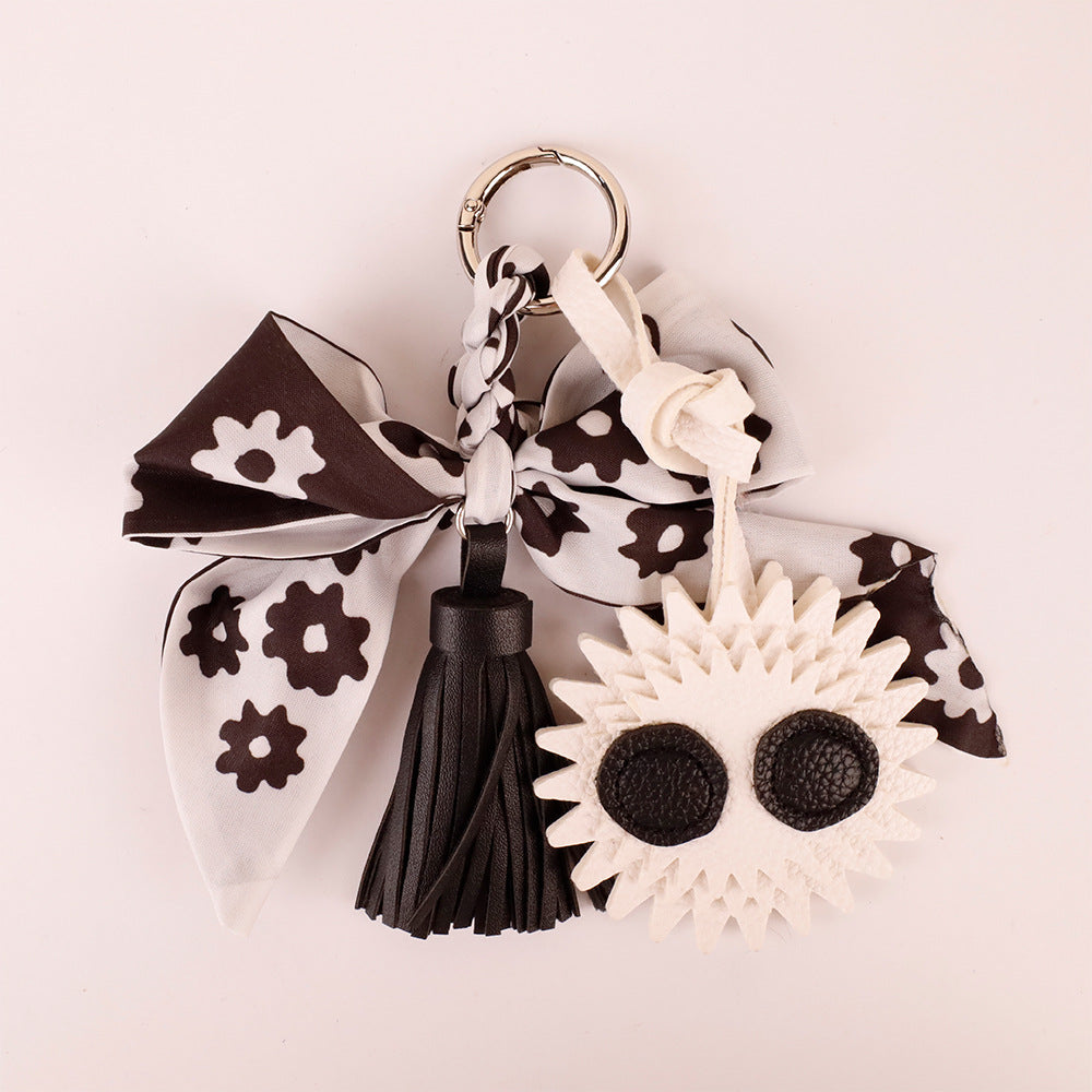 Black silk bow handbag ornament styled for spring outfit accessorizing