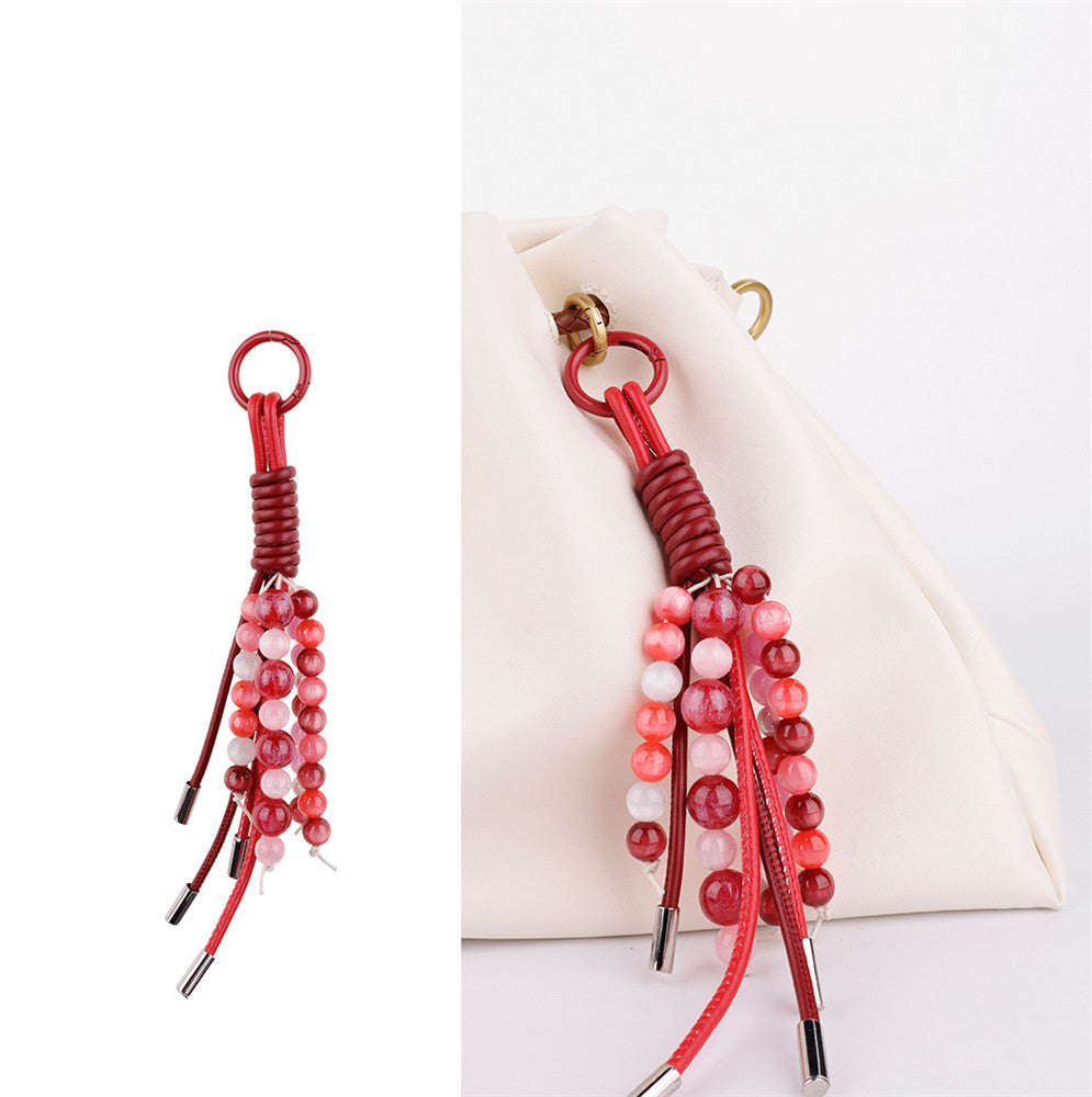 Natural stone beads decorating the handle of a tote