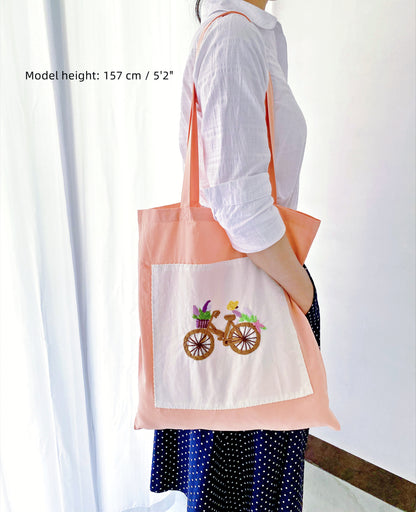 Oversized, ultra-soft orange cotton tote bag showcasing durability and capacity.