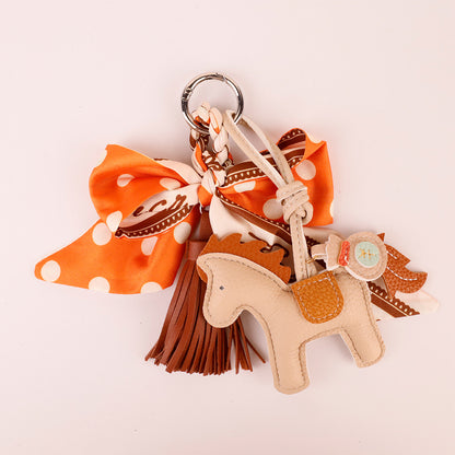 Handmade orange accessory for decorating handbags and totes