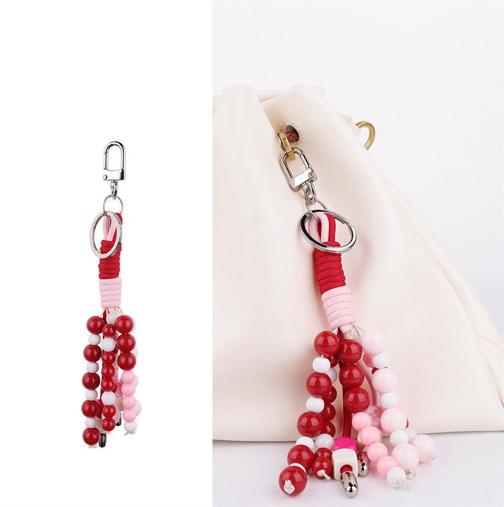 Earthy orange beadwork shown with a casual shoulder bag