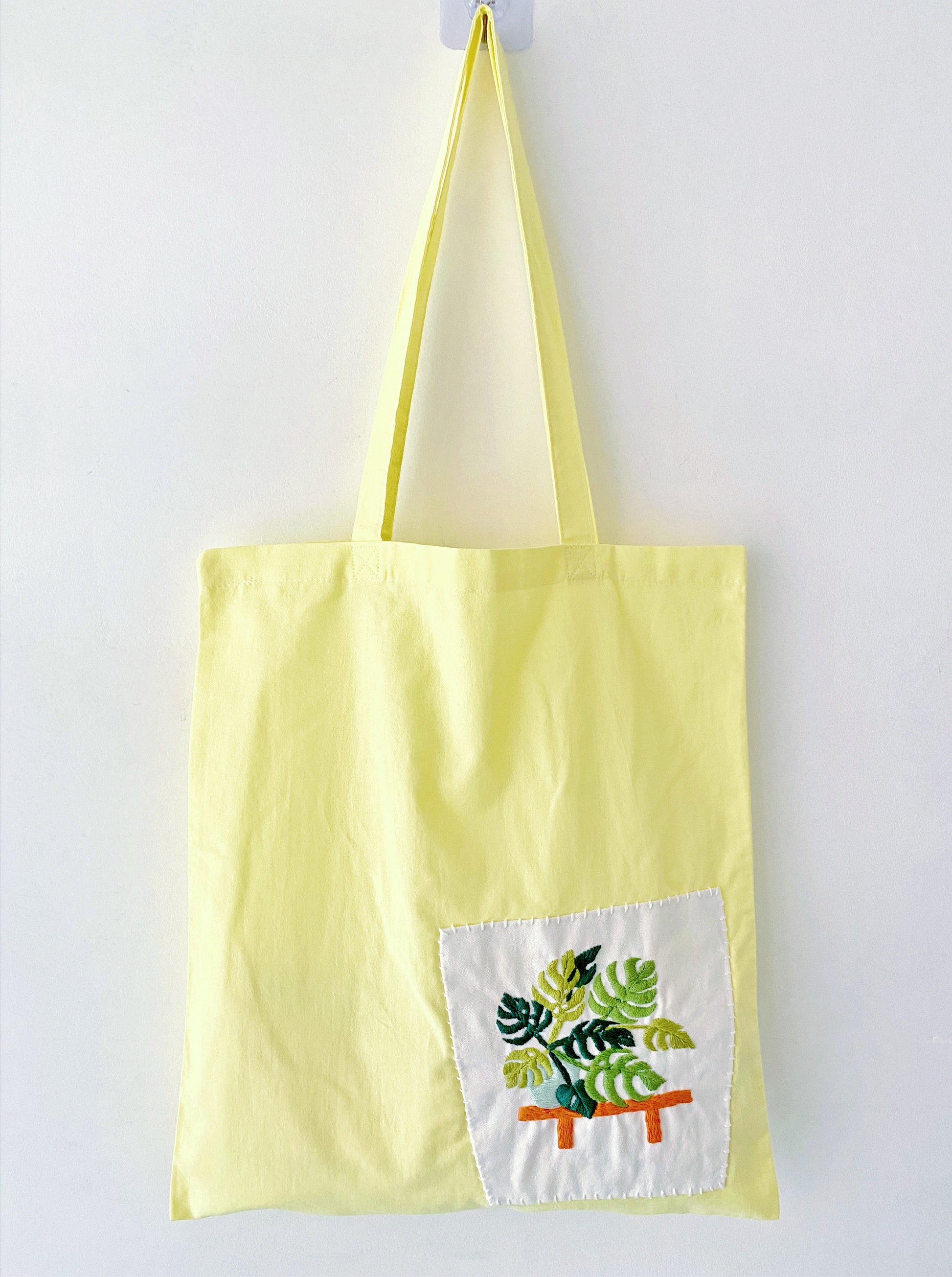 Lightweight and foldable yellow tote for travel or commute
