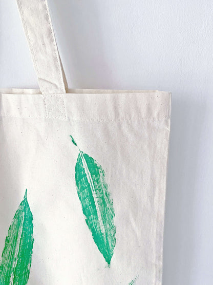 This large cotton tote with hand-printed leaves is more than just an accessory—it's a gift that brings nature and style together.