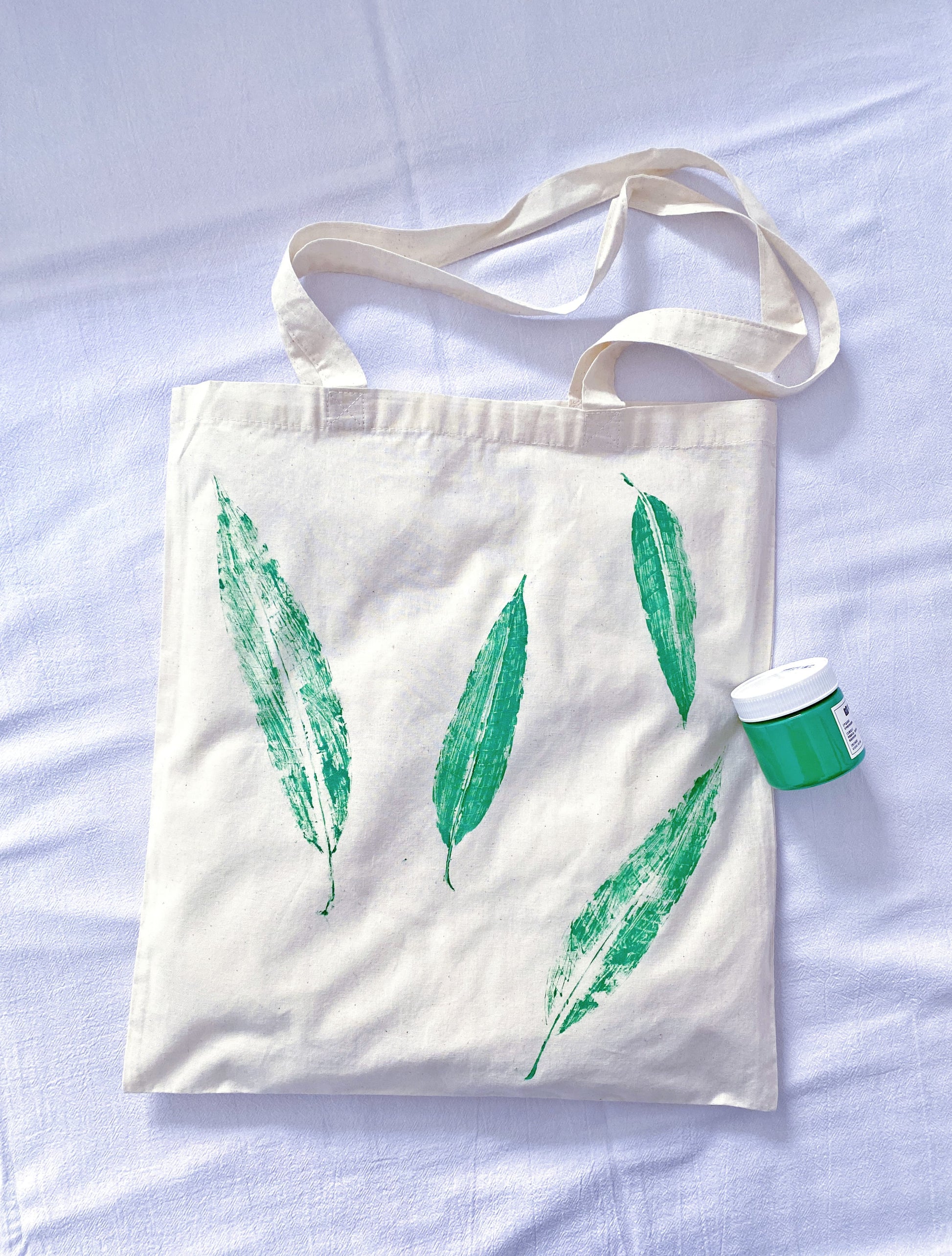 compact folded fabric tote revealing hand dyed leaf artwork texture