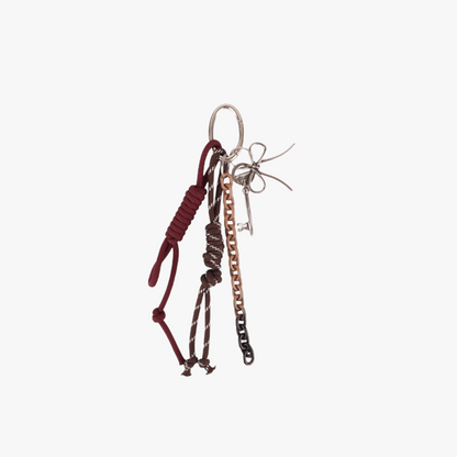 Sporty carabiner bag charm clipped to a canvas tote handle