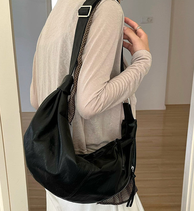 Casual shoulder purse for a relaxed weekend outdoors.