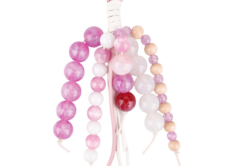 Handwoven jade bead keychain in a soft pink shade