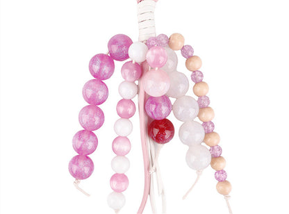 Handwoven jade bead keychain in a soft pink shade