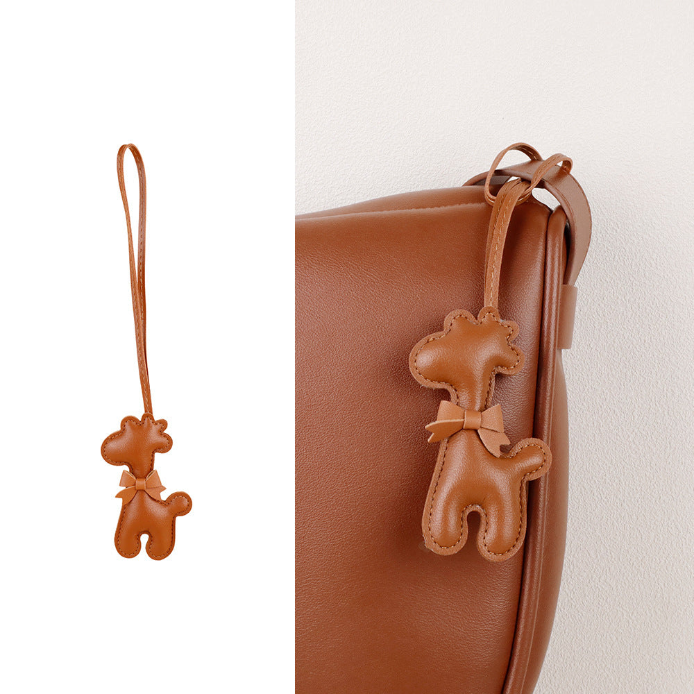 Handmade scarf detail with a charming giraffe figure