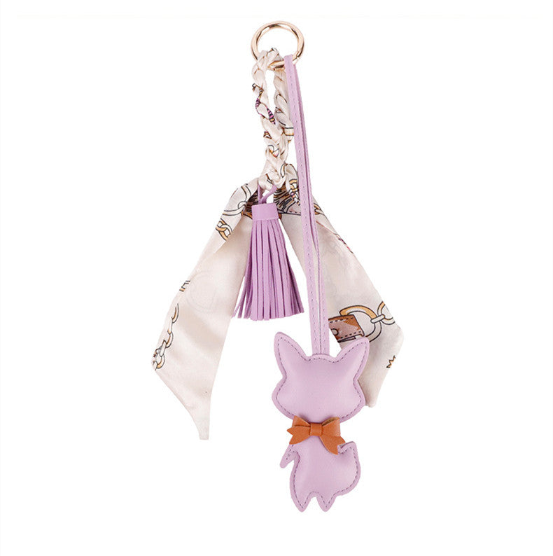 Handcrafted fox detail attached to a backpack zipper