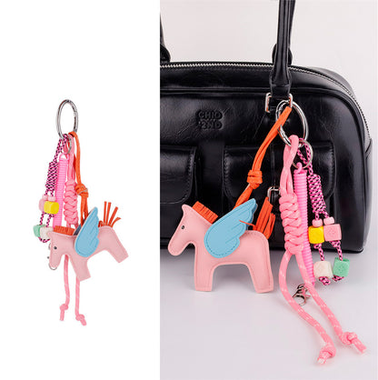 Cute colorblock pony decoration styled on a work tote