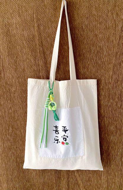minimalist embroidered bag as a small but thoughtful life moment gift