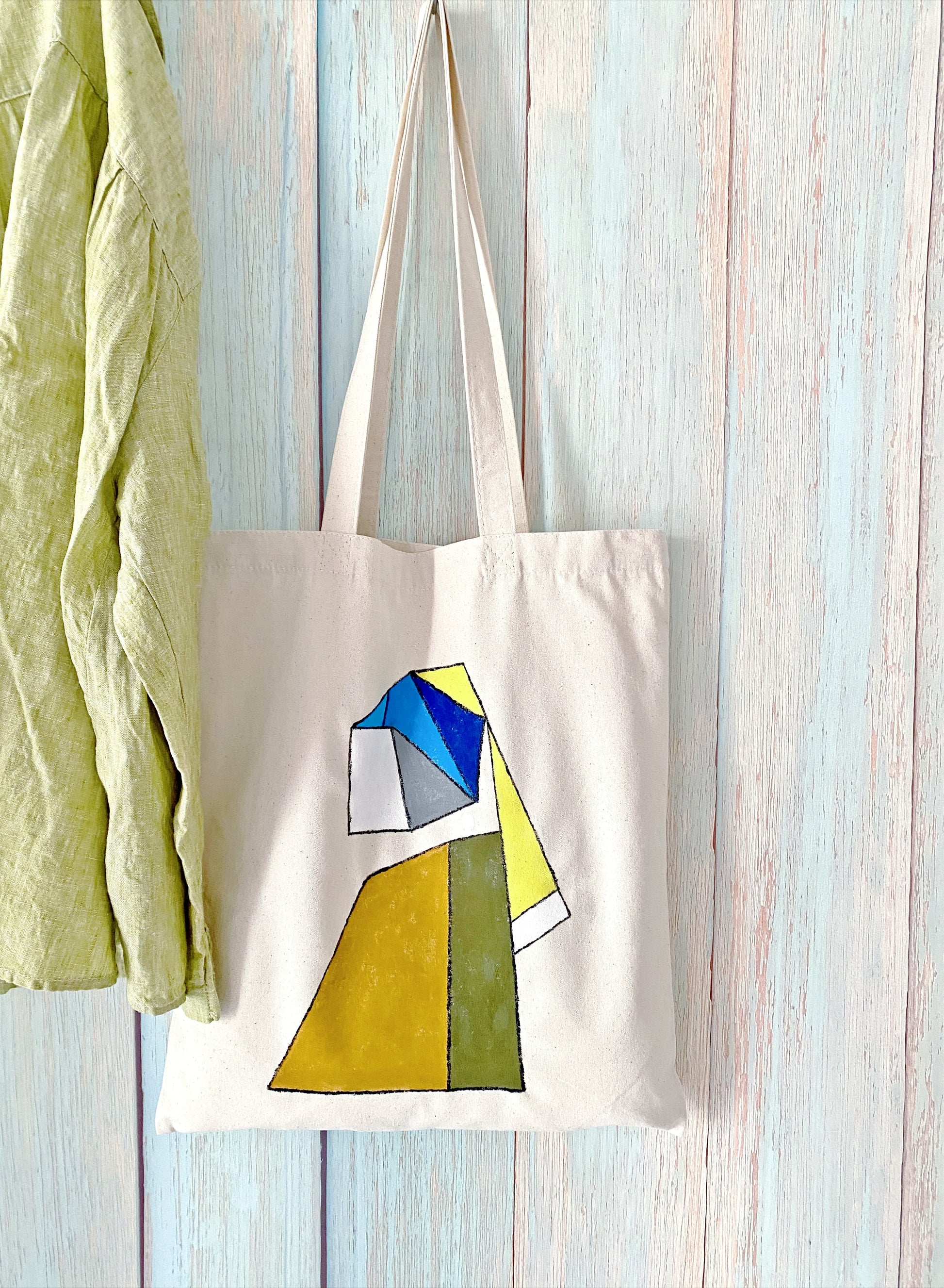 A versatile cream canvas tote styled for a weekend farmer's market or office commute.