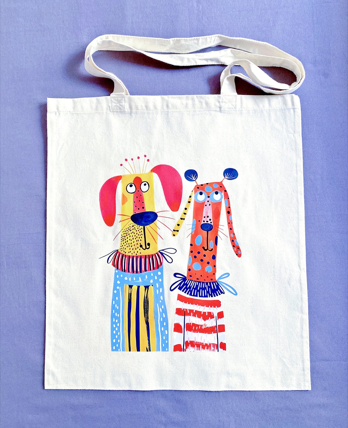 Large ultra-soft cotton tote with a hand-printed puppy design stuffed with a laptop and gym clothes for a busy commute