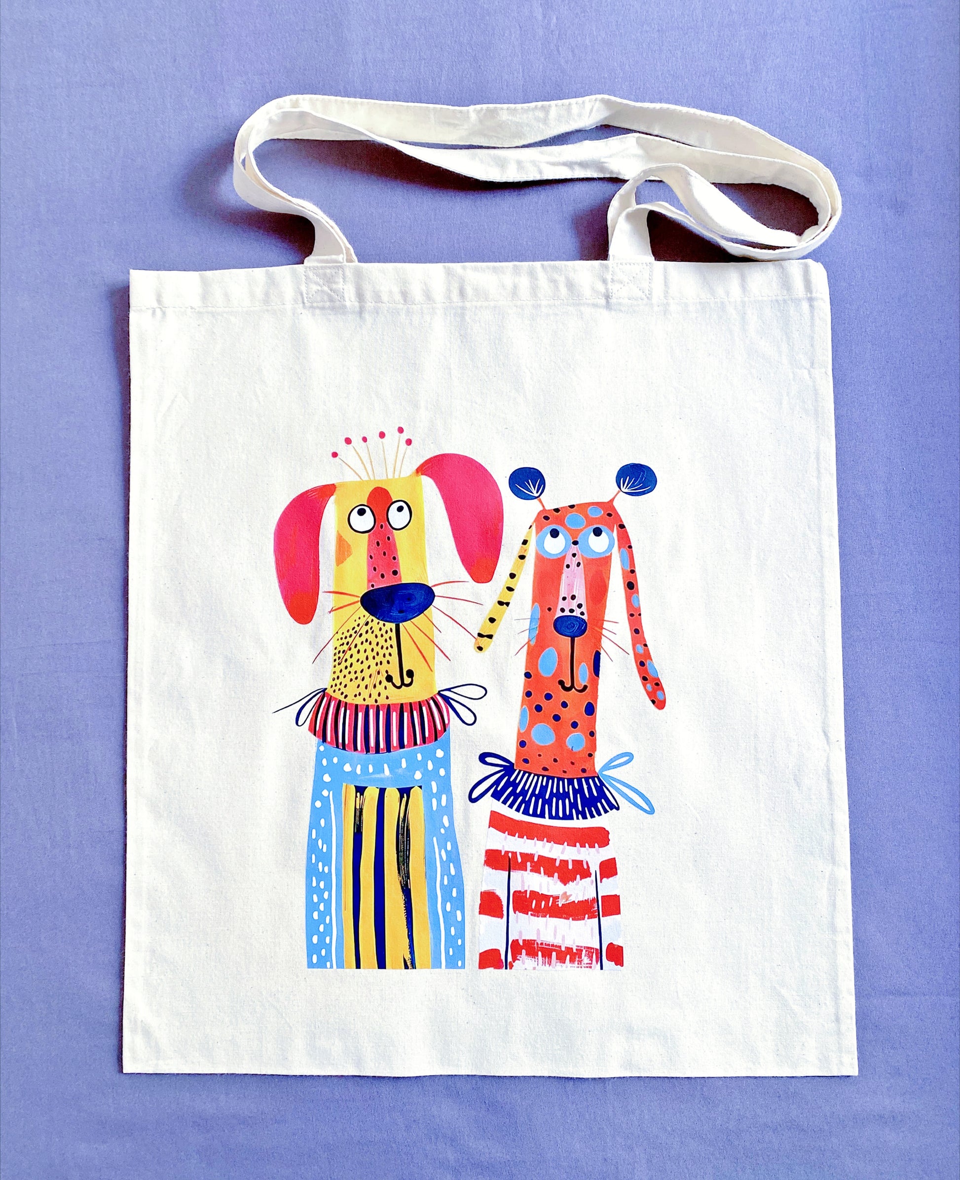 Large ultra-soft cotton tote with a hand-printed puppy design stuffed with a laptop and gym clothes for a busy commute