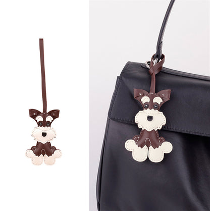 Playful puppy key accessory beside a car key set