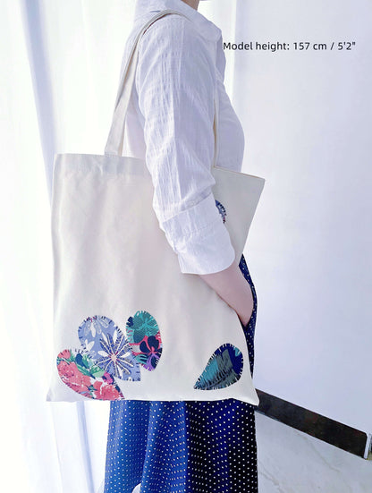 This large canvas tote makes a thoughtful gift for anyone who embraces eco-friendly living, offering plenty of room for all their essentials while supporting sustainable fashion.