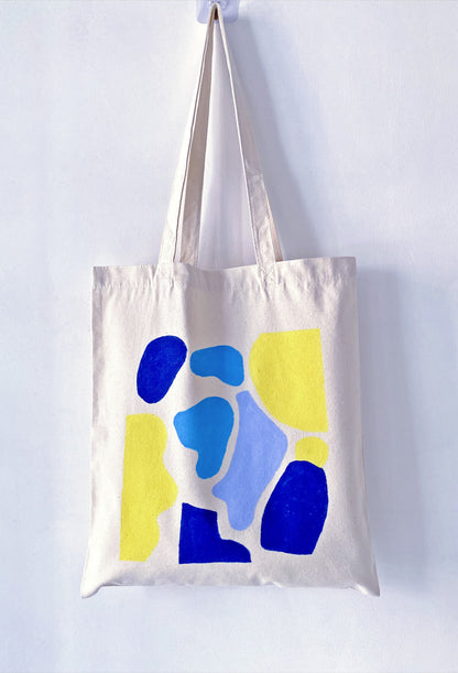 Close-up of tote fabric texture showing handcrafted printed artwork detail on canvas