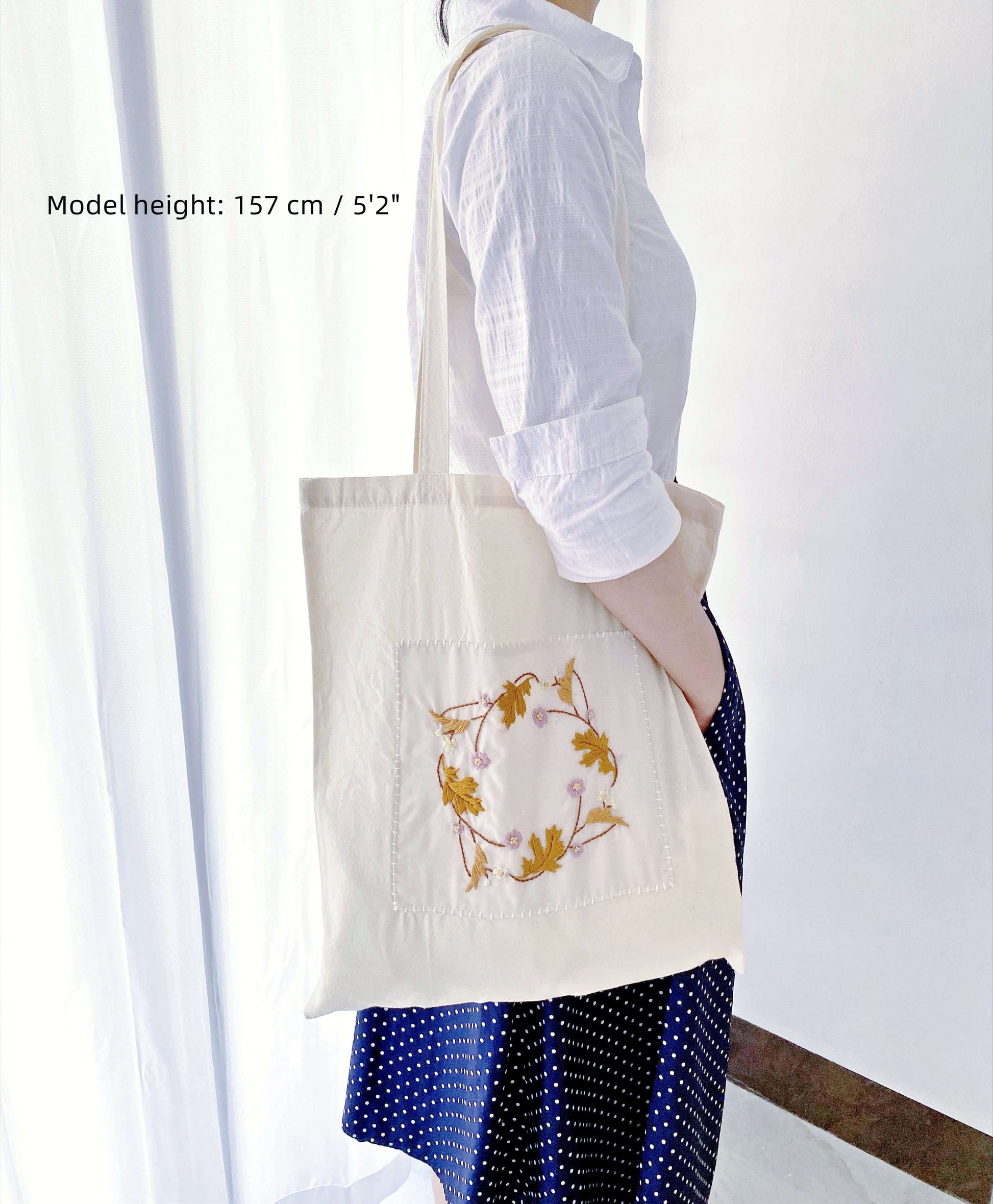 A thoughtful eco-conscious gift, this hand-embroidered cotton tote is perfect for those who care about the planet.