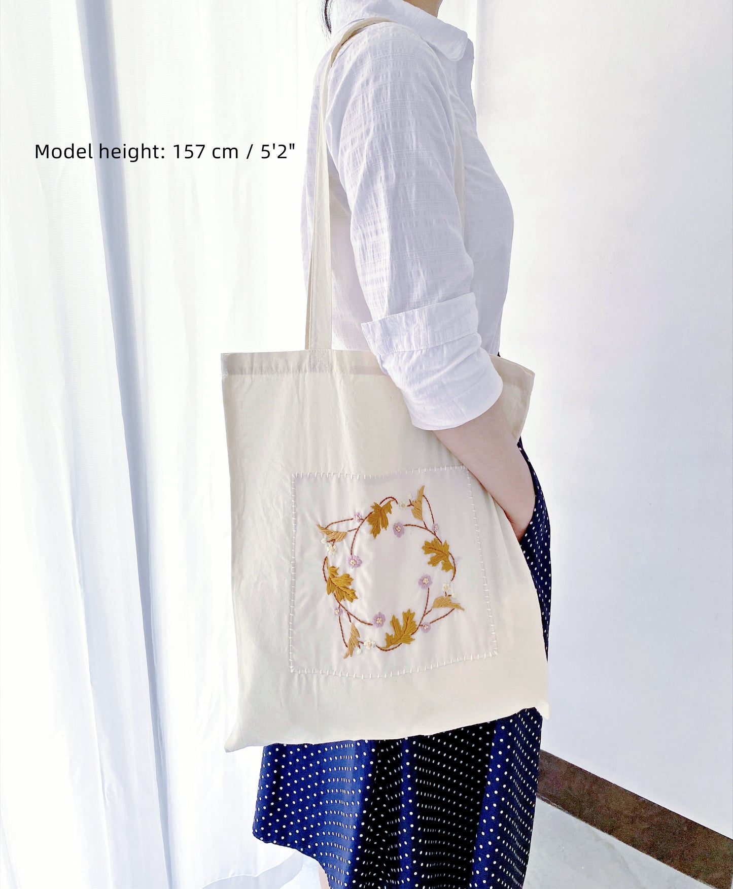 A thoughtful eco-conscious gift, this hand-embroidered cotton tote is perfect for those who care about the planet.