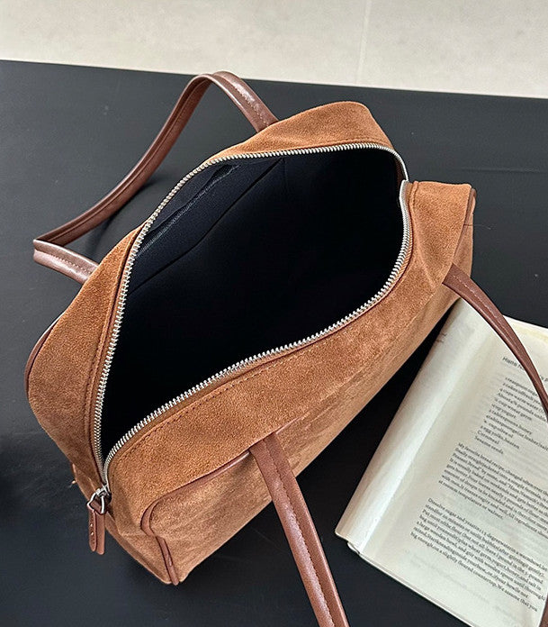 Shoulder handbag paired with relaxed fashion looks