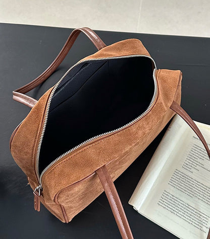 Shoulder handbag paired with relaxed fashion looks