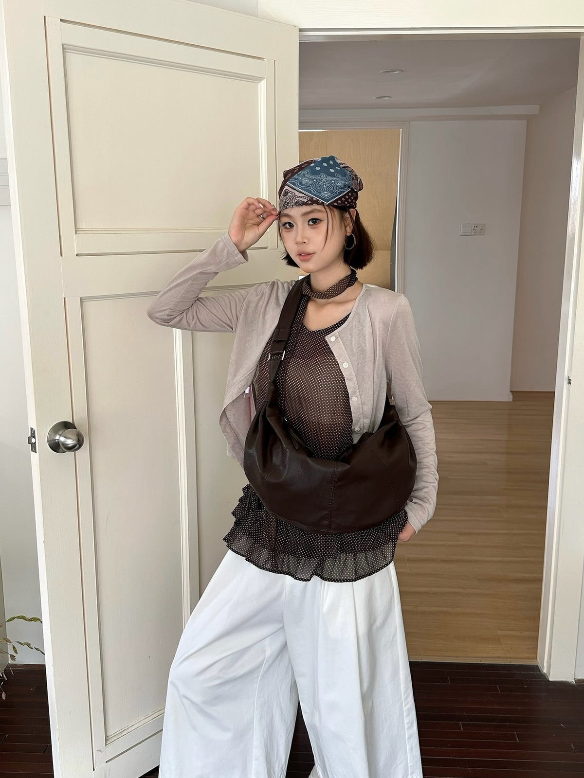 Large half-moon purse with a roomy main compartment.