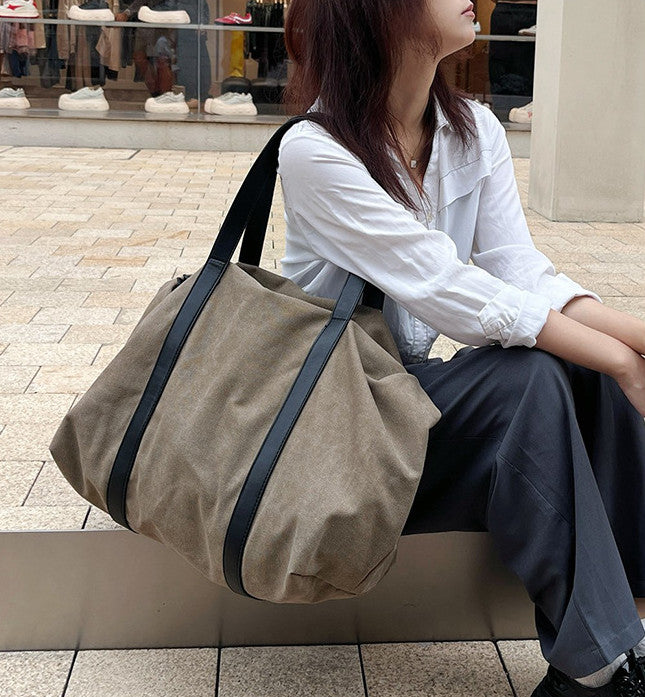 Large canvas shoulder bag for carrying daily essentials