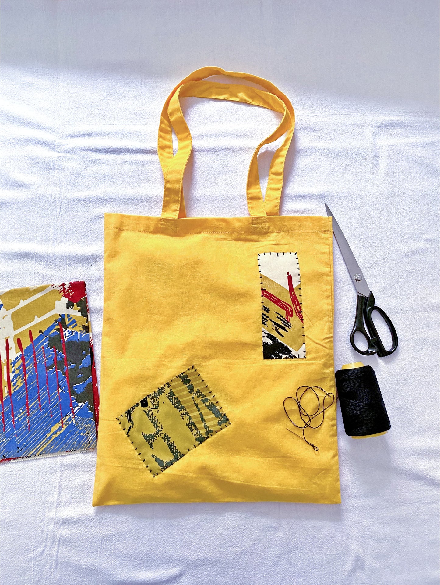 spacious tote bag with hand-applied patch accent styled for daily urban movement