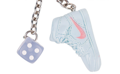 Braided cord bag charm with a playful street fashion feel