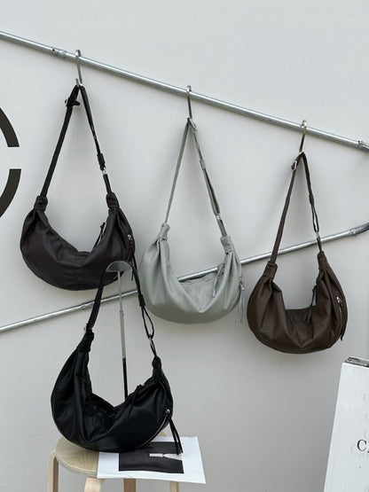 Soft-shaped handbag for leisurely afternoon walks.