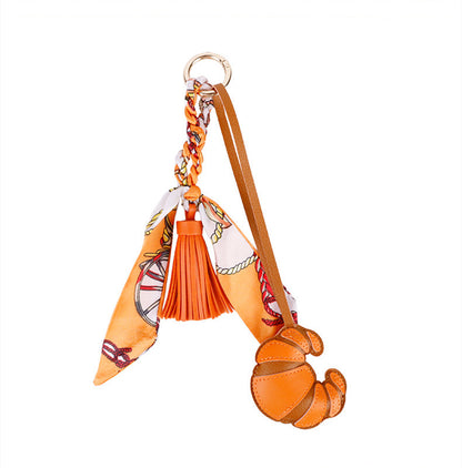Decorative tassel accessory styled with a classic purse