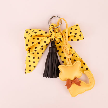 Handmade yellow bag accessory with scarf bow