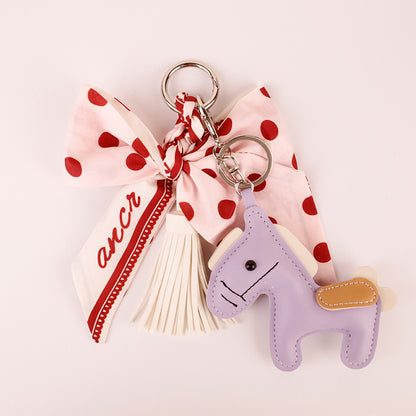Pink polka dot charm for styling a backpack