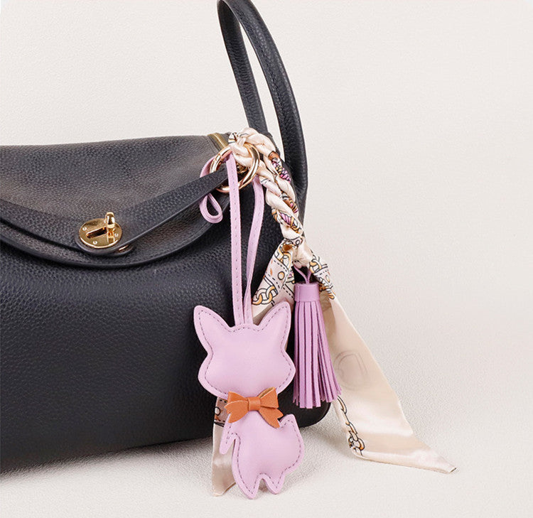 Leather fox charm styled with a colorful scarf
