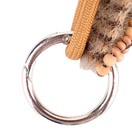 Distinctive bag ornament with beads and a tassel