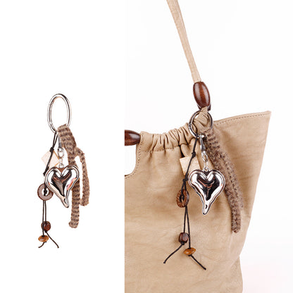 Handmade bag accessory featuring seed beads and wood