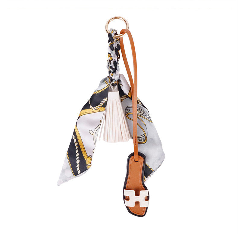 Creative shoe inspired charm for a leather purse