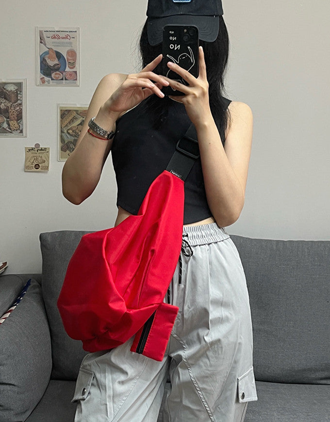 Women's curved crossbody bag with roomy space