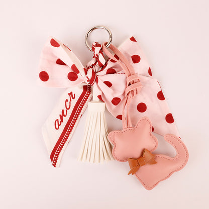 Scarf-inspired bow detail on a handmade bag charm